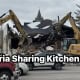 Fostoria News Demolition of Fostoria Sharing Kitchen with excavators tearing down the building.